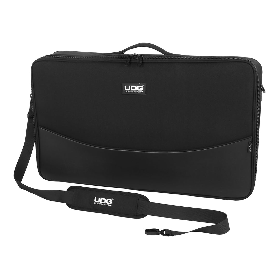 Black UDG carrying case with strap on a white background